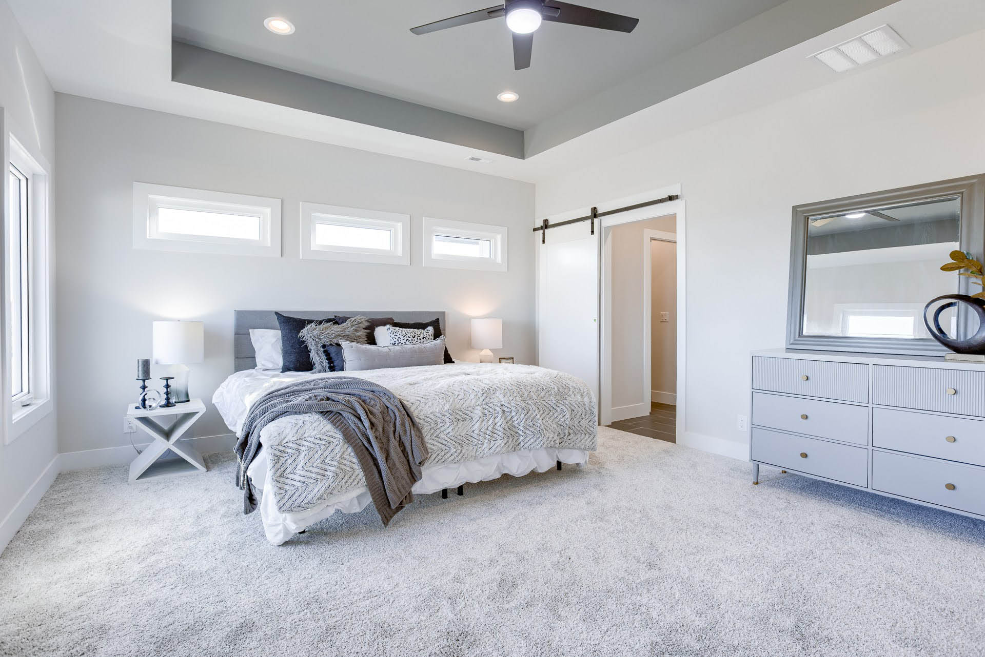 Primary bedroom with sliding door | Coventry Ridge I | Kimberly Cahoy Design