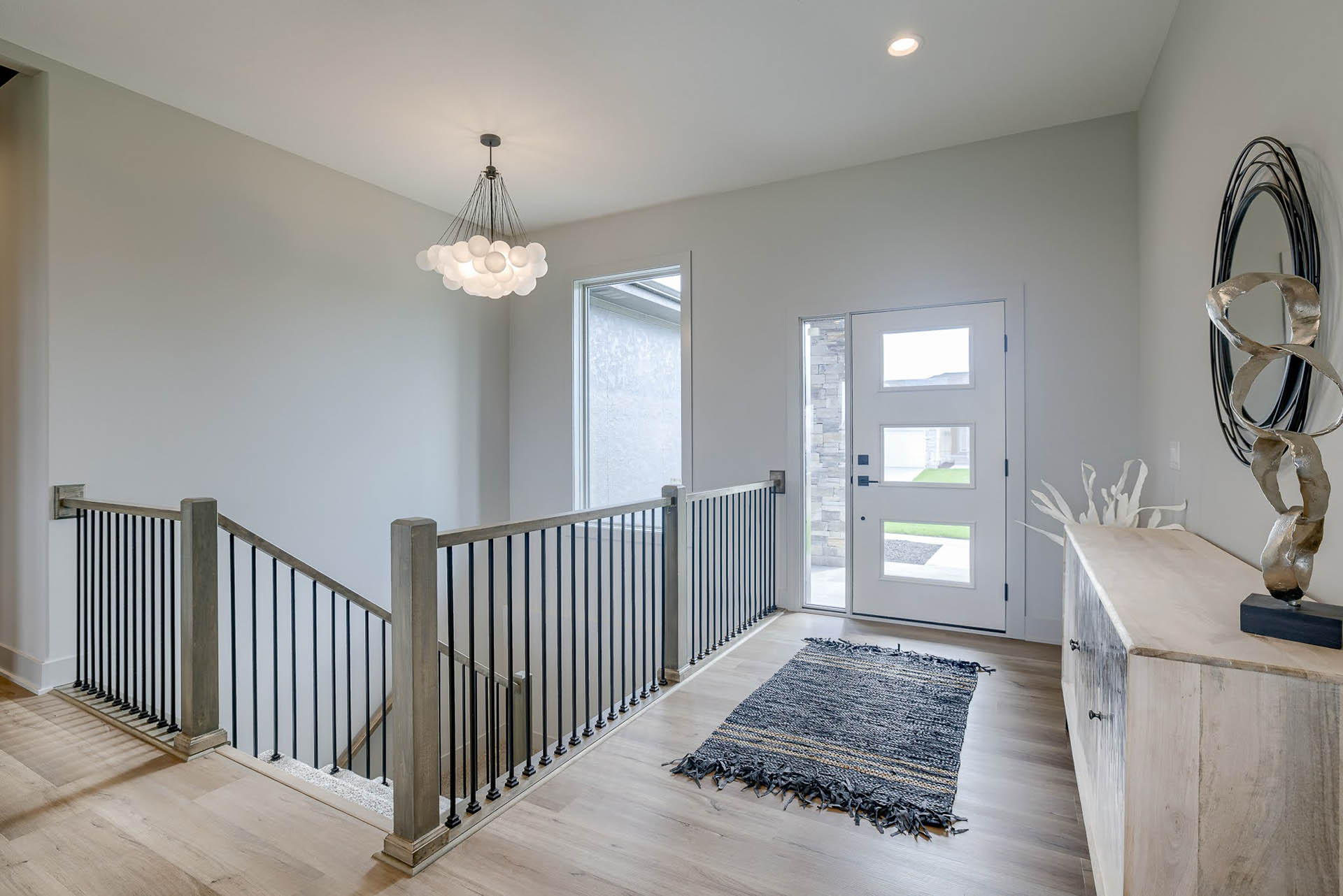 Entry way with stairs and lighting detail | Coventry Ridge II | Kimberly Cahoy Design