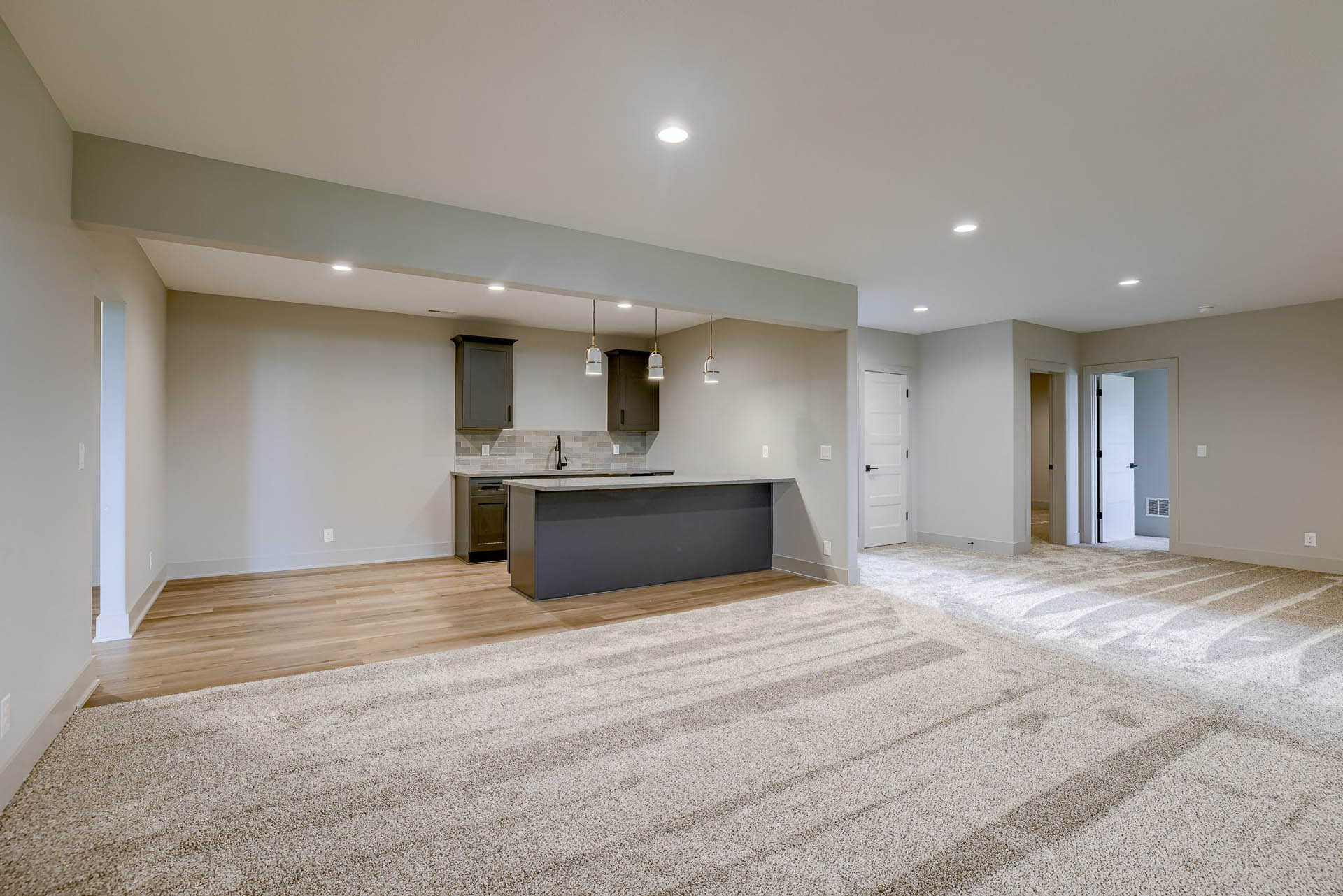 Finished basement with kitchenette cabinetry | Coventry Ridge II | Kimberly Cahoy Design